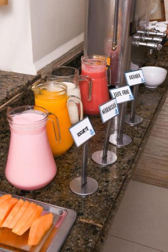 a group of different colored jars on a kitchen counter at Hotel Aquarius in Fortaleza