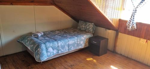 a small bedroom with a bed in a attic at HOME AWAY FROM HOME in Cape Town