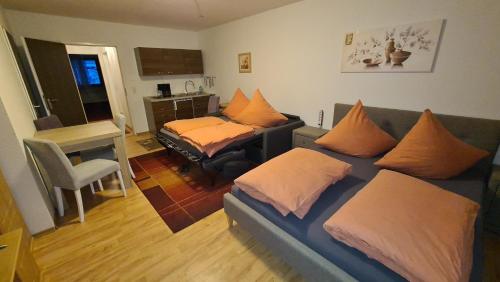 a living room with a couch with pillows on it at Schöne Apartment in Bayerische Wald,Sankt Englmar in Sankt Englmar