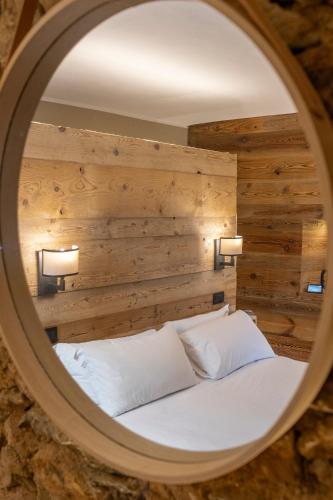Ένα ή περισσότερα κρεβάτια σε δωμάτιο στο Chalet l'ozio creativo