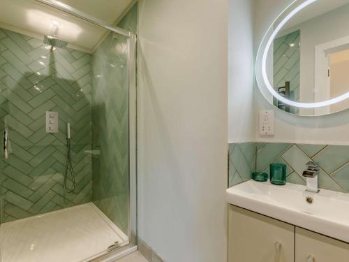 a bathroom with a shower and a sink at 4 Bed in Chulmleigh 85596 in Chulmleigh