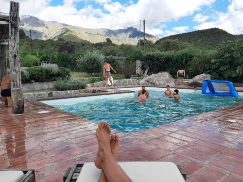 a group of people in a swimming pool at VILLA ESPINA CHALET DE MONTAÑA a 8 km de San Javier in Villa de Las Rosas