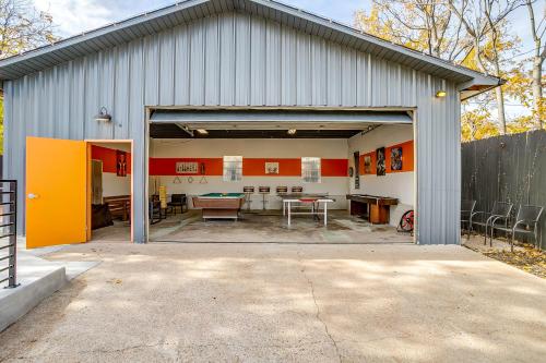 an open garage with a table and chairs in it at Pickleball Court - Walk to AT&T Stadium, Globe Life, Six Flags, Texas Live! & more in Arlington