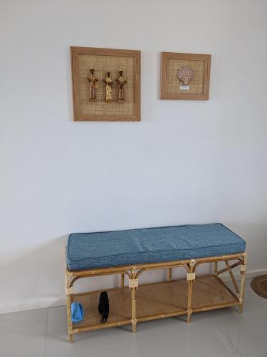 a bench sitting on a table in a room at Seaview serenity apartment in Flic-en-Flac