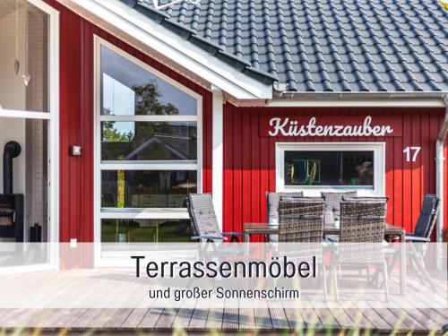 a restaurant with a table and chairs outside of it at Ferienhaus Küstenzauber Kalifornien - mit Hund - komplett eingezäunter großer Garten - Sauna und Kamin - im Sommer Strandkorb inklusive in Schönberg in Holstein