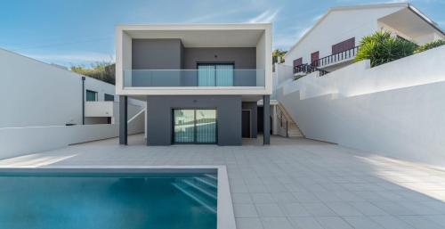 a rendering of a house with a swimming pool at Villa Foz - By SCH in Foz do Arelho