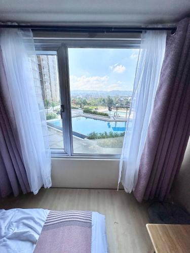 Doms Ryokan in Avida Aspira With Wifi and Netflixにあるベッド