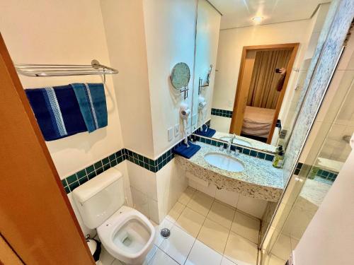 a small bathroom with a toilet and a sink at LFlats no Hotel Stella Vega (EX-Mercury Ibirapuera) in Sao Paulo