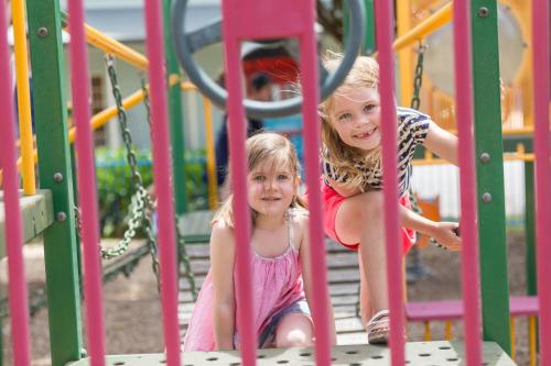 two little girls playing on a playground at NRMA Ballarat Holiday Park in Ballarat