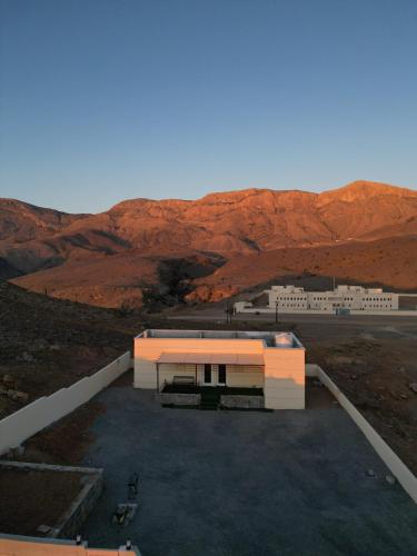 an aerial view of a building in the desert at Sunset view hill jabal shams in Misfāh