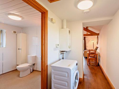 a bathroom with a toilet and a sink at 1 bed in Allonby 28791 in Allonby