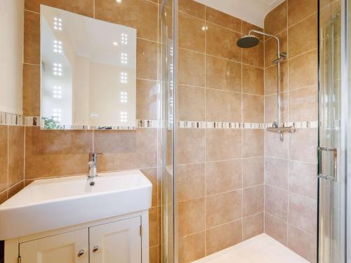 a bathroom with a sink and a shower at 2 Bed in Llangollen 43916 in Overton