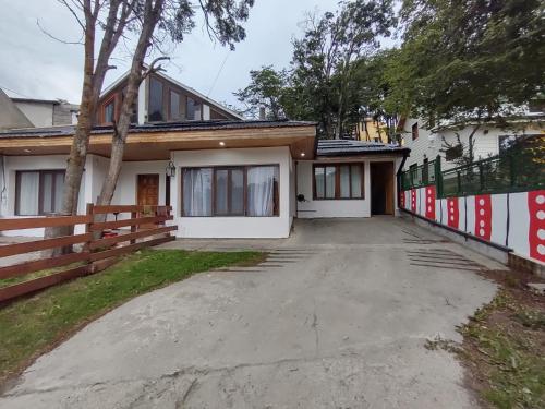 a house with a driveway in front of it at Ananda in Ushuaia