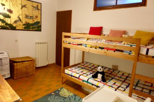 Ένα ή περισσότερα κρεβάτια σε δωμάτιο στο CHARMANTE MAISON A SAINT GUILHEM LE DESERT