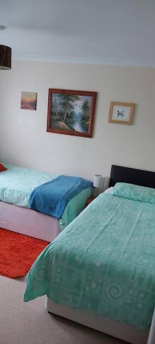 Ένα ή περισσότερα κρεβάτια σε δωμάτιο στο Homely Haven, Dunfermline