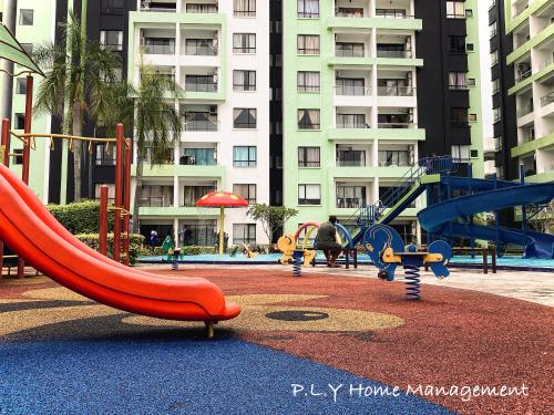 a playground with a slide and a slidesktop at Manhattan Condo Ipoh Waterpark PoolView FREE Carpark & Netflix by PLY Home in Ipoh