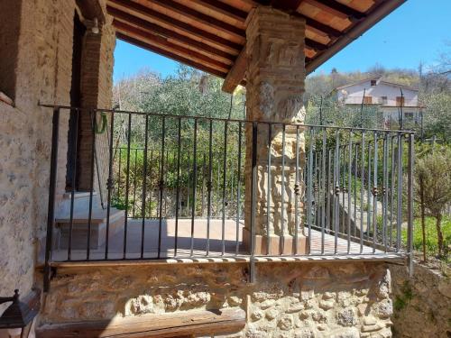 a balcony of a house with a iron railing at Il Vicolo House in Santa Rufina