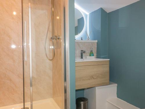 a bathroom with a shower and a sink at Blacksmiths Cottage in Newquay