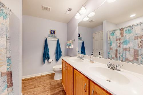 a bathroom with a sink and a toilet at Creekside --- 13 Hull Ln in Millville