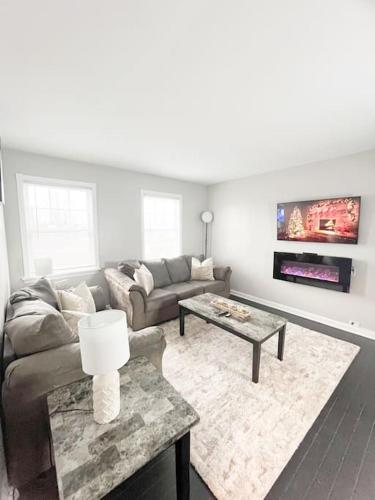 a living room with a couch and a coffee table at The Gateway: Entire Apartment 7 mins from airport in Cleveland