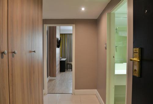 a hallway with a door leading to a room at The Capetonian - Halal in Cape Town