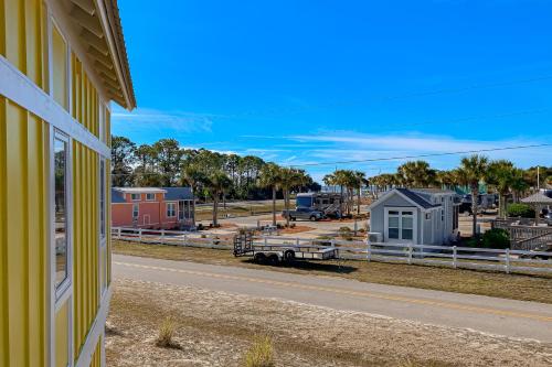 a house on the side of a road next to a property at Sunshine Haven in Carrabelle