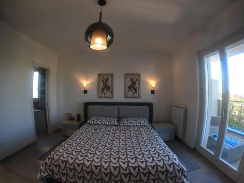 Ένα ή περισσότερα κρεβάτια σε δωμάτιο στο Lecce Parkside Apartment