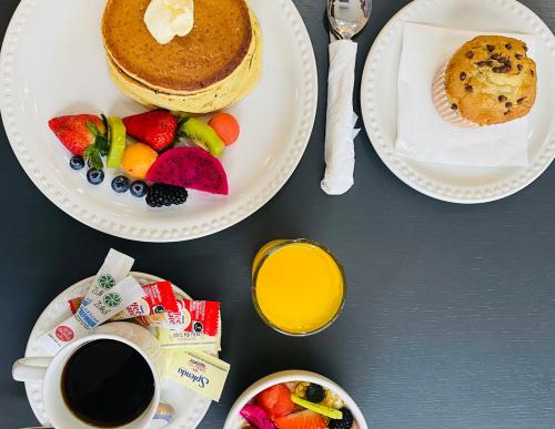 a table with two plates of food and a cup of coffee at La Quinta by Wyndham Reynosa in Reynosa
