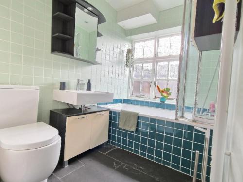 a bathroom with a toilet and a sink at 1 bed- Flat in Kings Cross in London