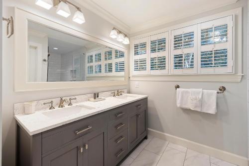 a bathroom with a sink and a mirror at 18 Ocean Green in Kiawah Island