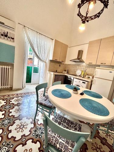 a kitchen with a table and chairs in a room at DIMORA ELIVA in Monopoli