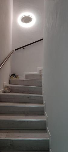 a set of stairs with a light on the ceiling at La Finestra sul Lago in Brusimpiano