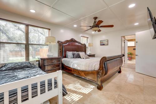 a bedroom with a bed and a ceiling fan at San Antonio Home Private Pool and Covered Patio in San Antonio