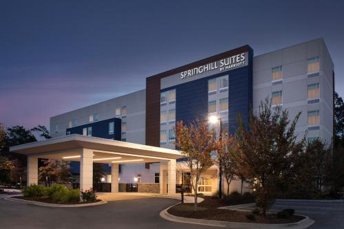 a hospital building with a sign that reads swift guild services at SpringHill Suites By Marriott Charleston Airport & Convention Center in Charleston