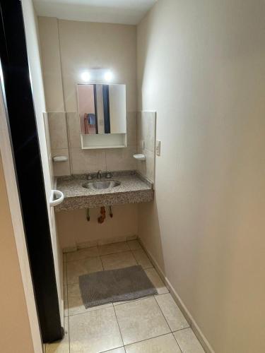 a bathroom with a sink and a mirror at Bv San Juan - Nva Cba in Córdoba