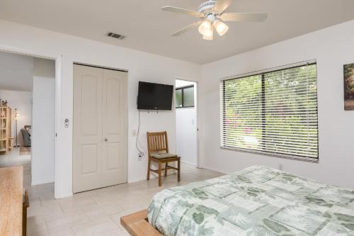 a bedroom with a bed and a ceiling fan at Addy by the Lake in Port Charlotte