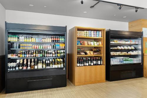 a room with two refrigerators with bottles of alcohol at Holiday Inn San Francisco - Golden Gateway newly renovated with No Resort Fee in San Francisco