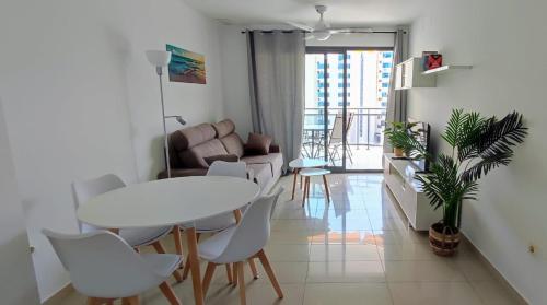 a living room with a white table and chairs at Apartamento Vistas al mar en Gemelos 24 La Cala de Finestrat in Alicante
