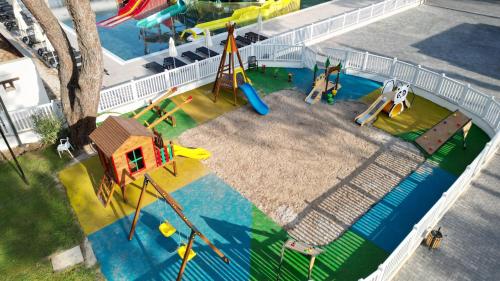 an aerial view of a playground with slides and a house at Siu Collection - Ultra All Inclusive in Beldibi