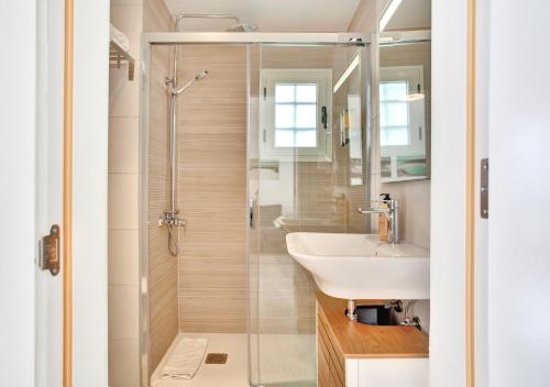 a bathroom with a shower and a sink at Silvic Serenada in Corralejo