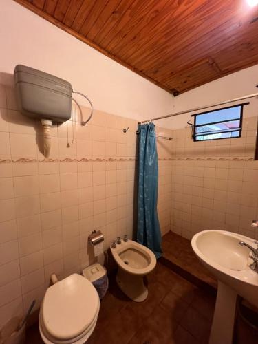 a bathroom with a toilet and a sink at Dorbozy in Wanda