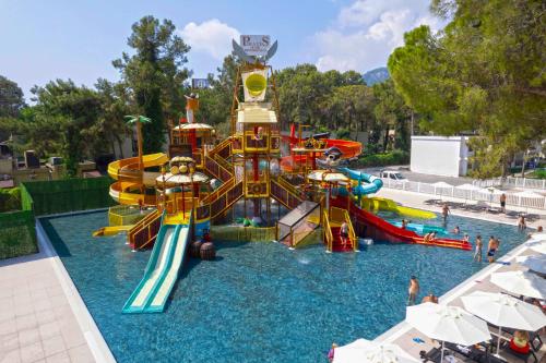 a water park with a water slide in the water at Siu Collection - Ultra All Inclusive in Beldibi