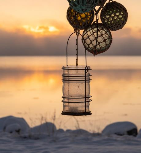 a container with fruit on top of it in the snow at Norwegian Wild in Vangsvik