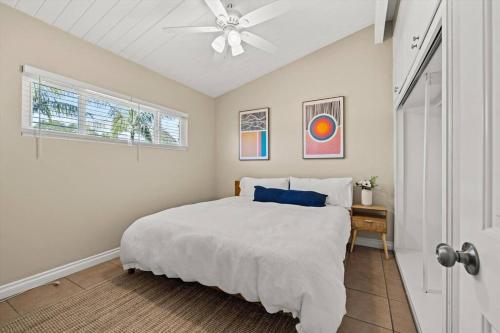 a white bedroom with a bed and a ceiling fan at New 2 Bed Apartment Close to Downtown and Beach in Santa Barbara