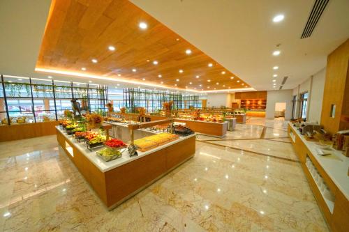 a large lobby with a buffet line in a building at Siu Collection - Ultra All Inclusive in Beldibi