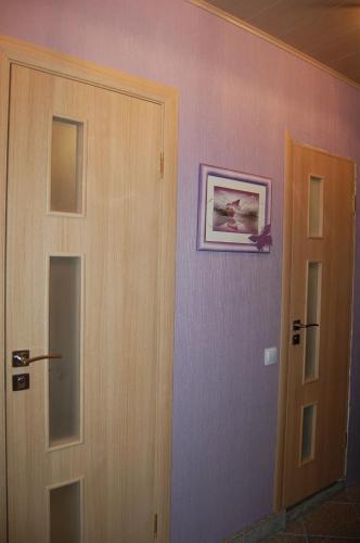 a room with a door and a picture on the wall at Kate Sea Apartment in Pärnu