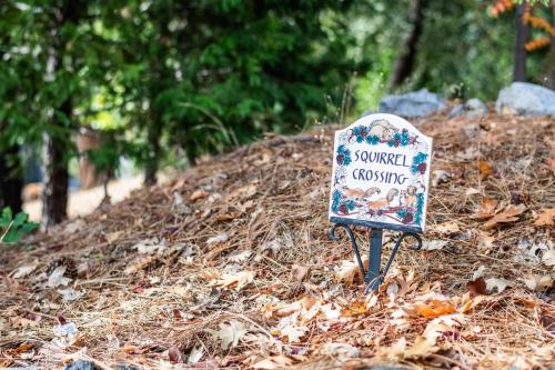 a sign in the pile of leaves in a park at Inn at Sugar Pine Ranch in Groveland