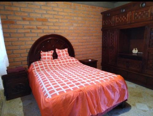 Cabaña Rodeada de Naturaleza tesisinde bir odada yatak veya yataklar