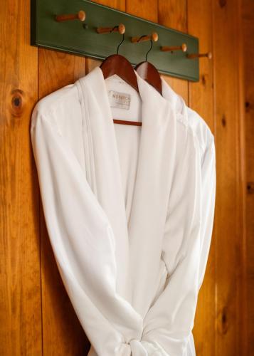 a white shirt hanging on a wall at Inn at Sugar Pine Ranch in Groveland