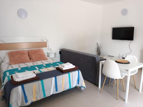 Katil atau katil-katil dalam bilik di Apartamentos Falcón